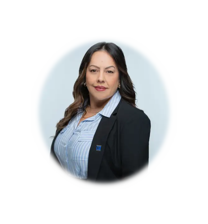 Nayeli in professional attire wearing a black blazer over a striped shirt